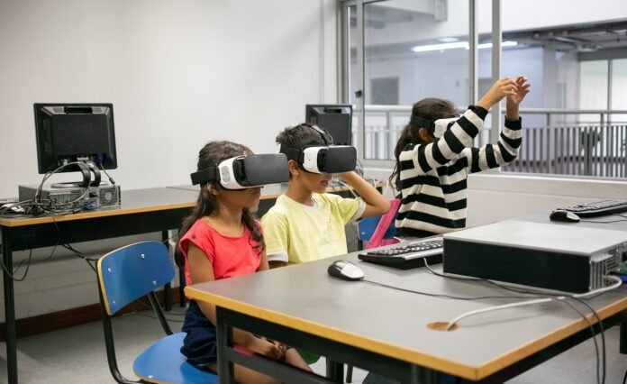 kids learning to use virtual reality glasses
